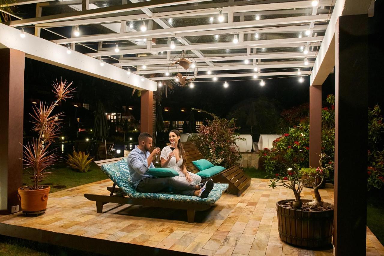 Hotel Boutique Frangipani Brotas Extérieur photo A pergola with a retractable roof