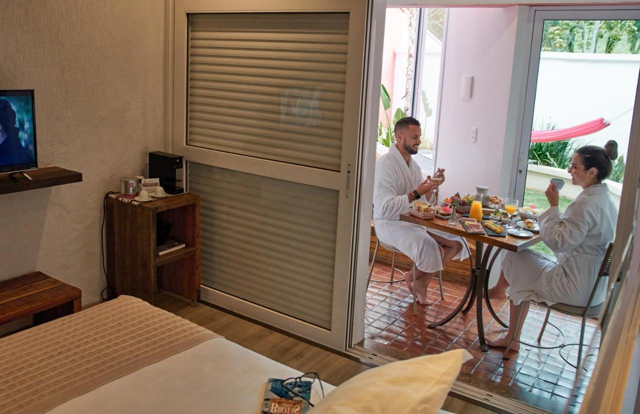 Hotel Boutique Frangipani Brotas Extérieur photo A room at the hotel