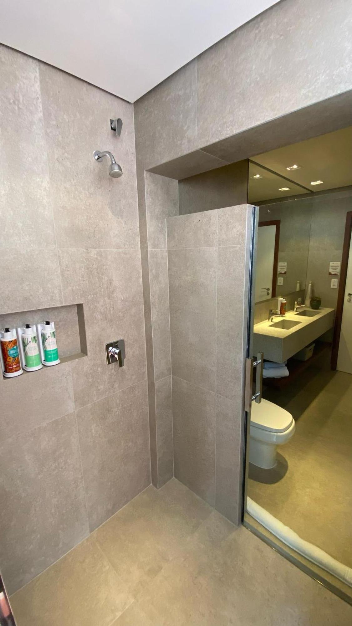 Hotel Boutique Frangipani Brotas Extérieur photo A shower door